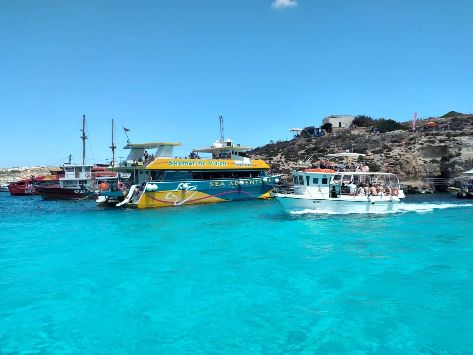 Blue water and boats at Comino’s Blue Lagoon