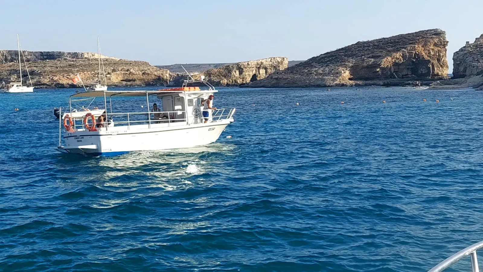 Comino Land boat at sea